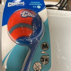 A tennis ball thrower for dogs